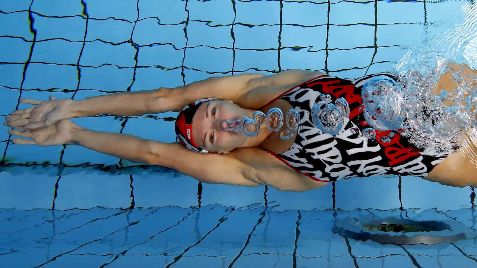 Hungarian swimmer Katinka Hosszu exhales underwater at a training session in Budapest, Hungary July 15, 2015. Before she became 2014 World Swimmer of the Year…