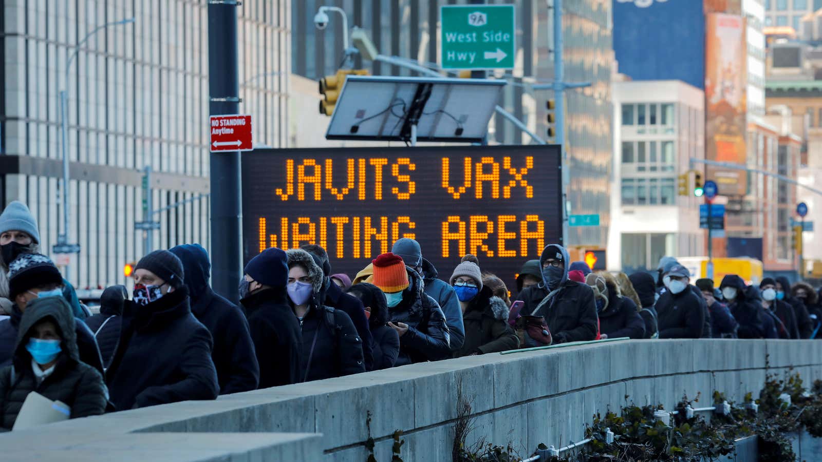 People wait to receive a Covid-19 vaccine at a convention center in Manhattan in March.