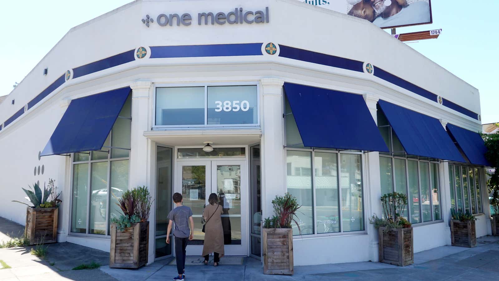 People enter a One Medical office on July 21, 2022 in Oakland, California.