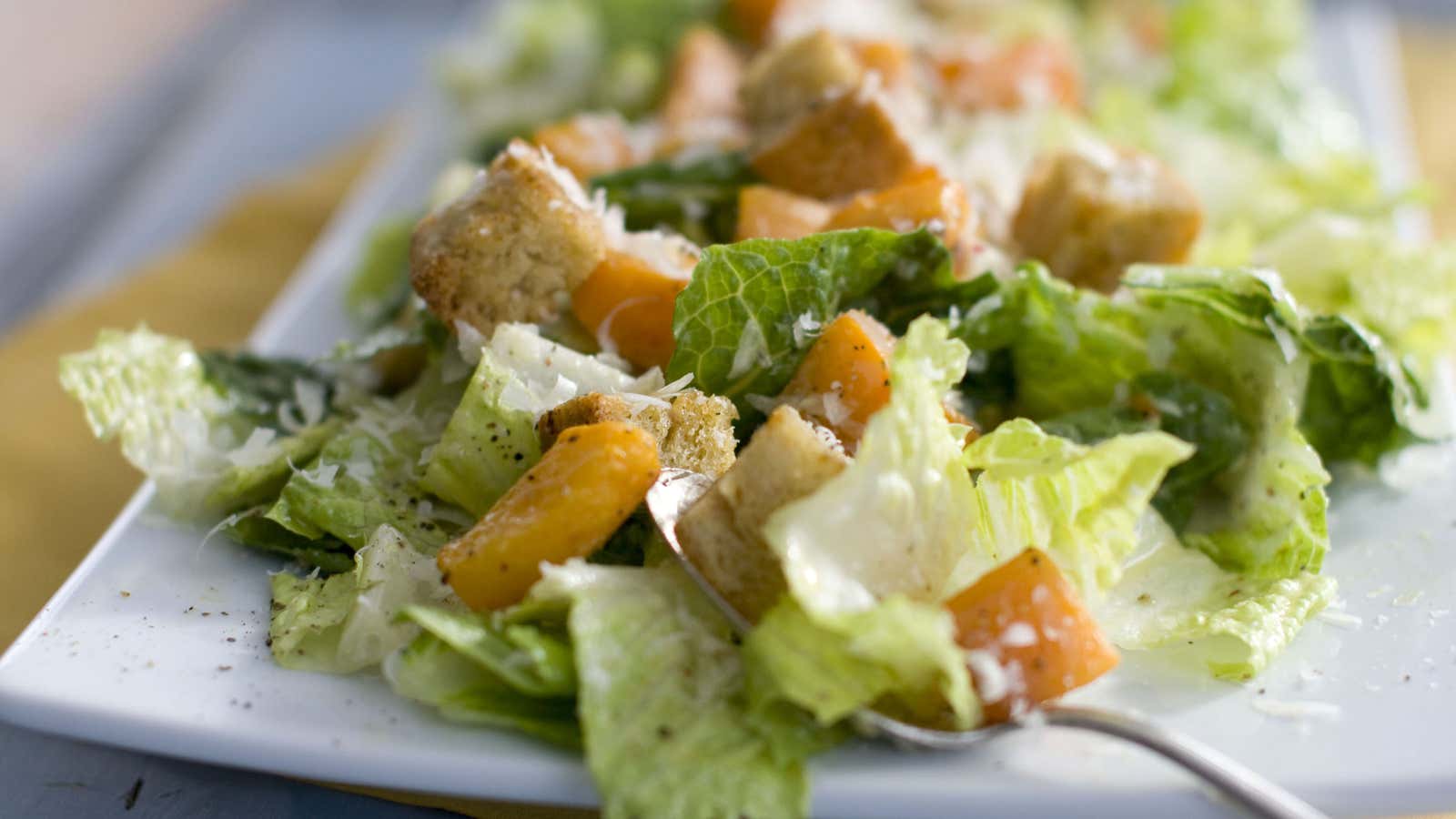 In this Jan. 24, 2012 photo, a plate of butternut Caesar salad with Romaine lettuce and roasted cubes of butternut squash, is shown. (AP Photo/Matthew Mead)