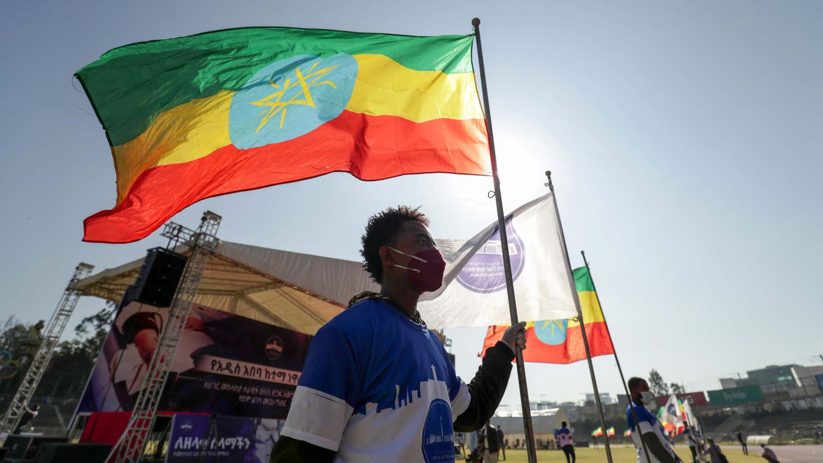 A volunteer holds an Ethiopian flag during a blood donation ceremony for the injured members of Ethiopia’s National Defense Forces (ENDF) fighting in Tigray Nov. 12, 2020.