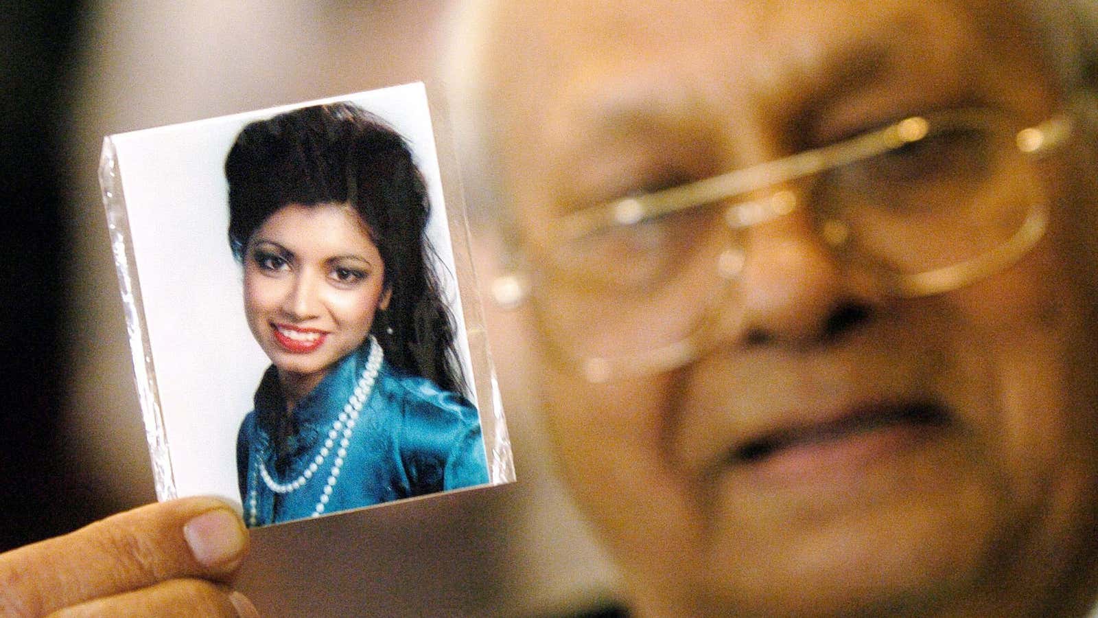 In this 2005 photo, Rattan Singh Kalsi shows a photograph of his daughter, Indira, at a meeting with families of the victims of the 1985 Air India bombing.