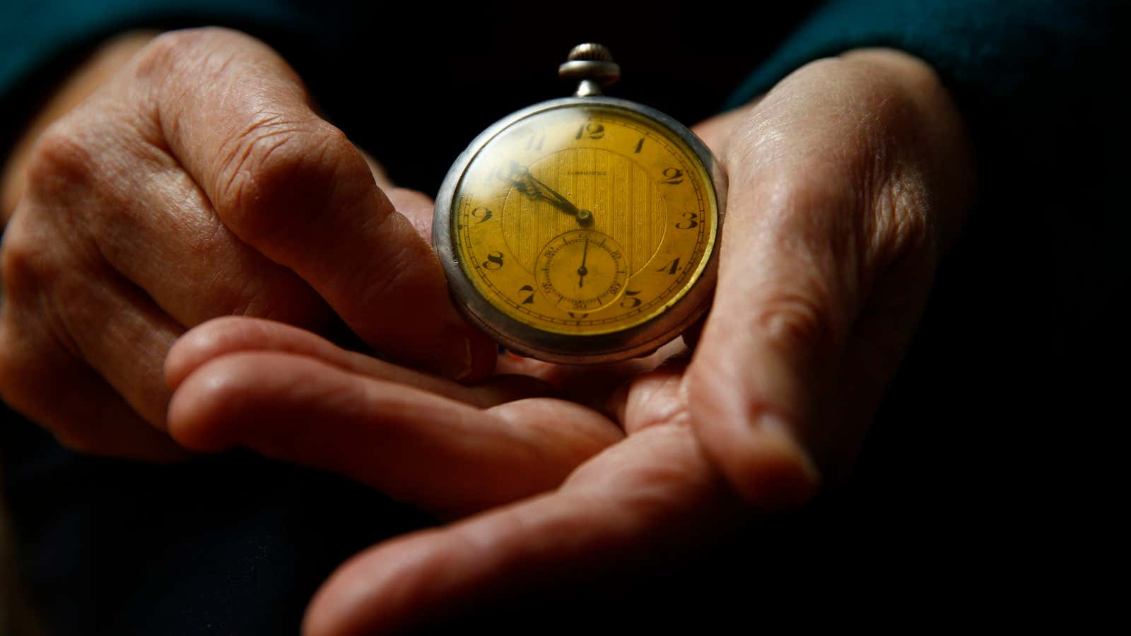 Auschwitz death camp survivor Elzbieta Sobczynska holds her father’s watch as she poses for a portrait in Warsaw.