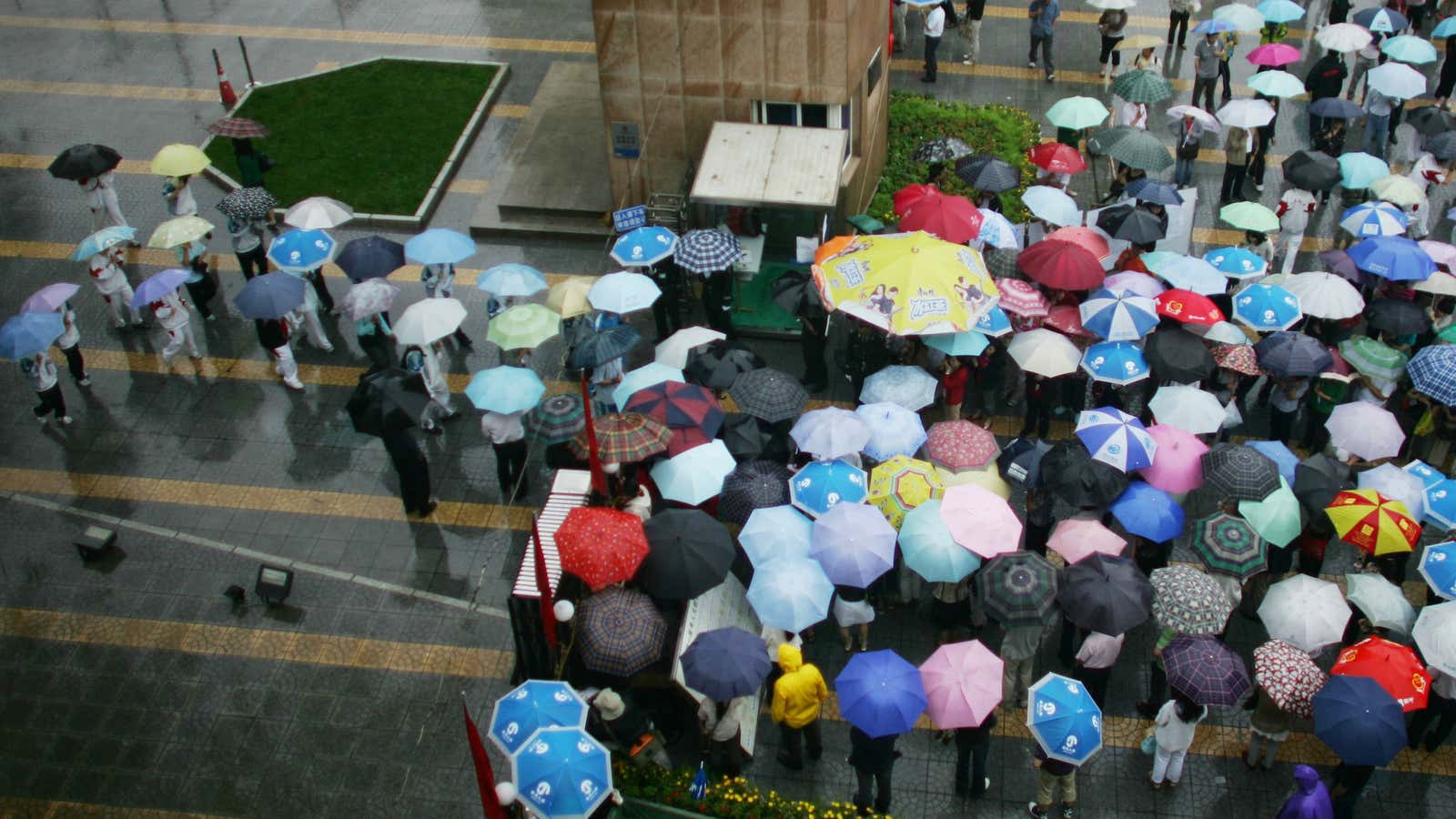 Parents wait while their children take China’s national university entrance exam.