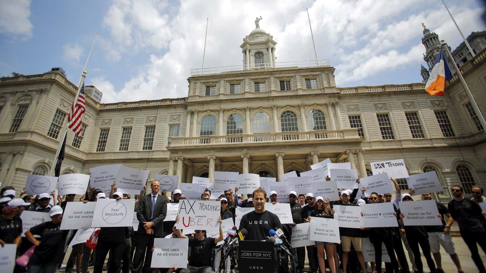 Uber employees and drivers protest a bill that would halt the company’s expansion in New York City.