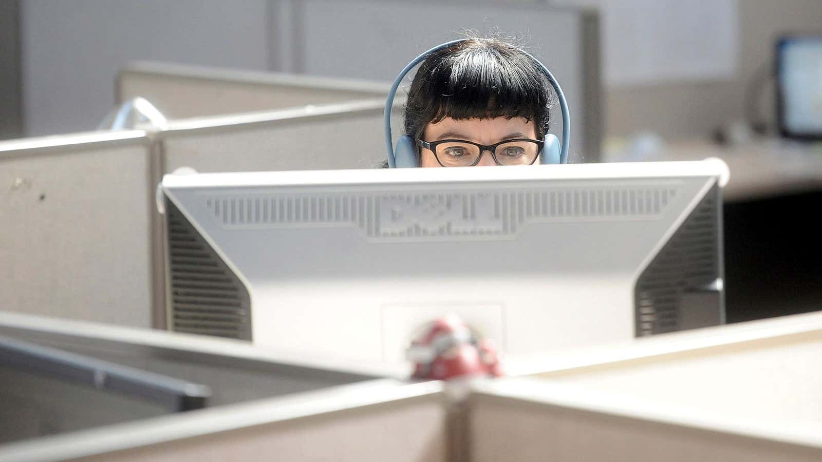 Bonnie Burton, director of social media strategy for Revision3, works at her cubicle in San Francisco, California October 3, 2012. Revision3 is part of an…