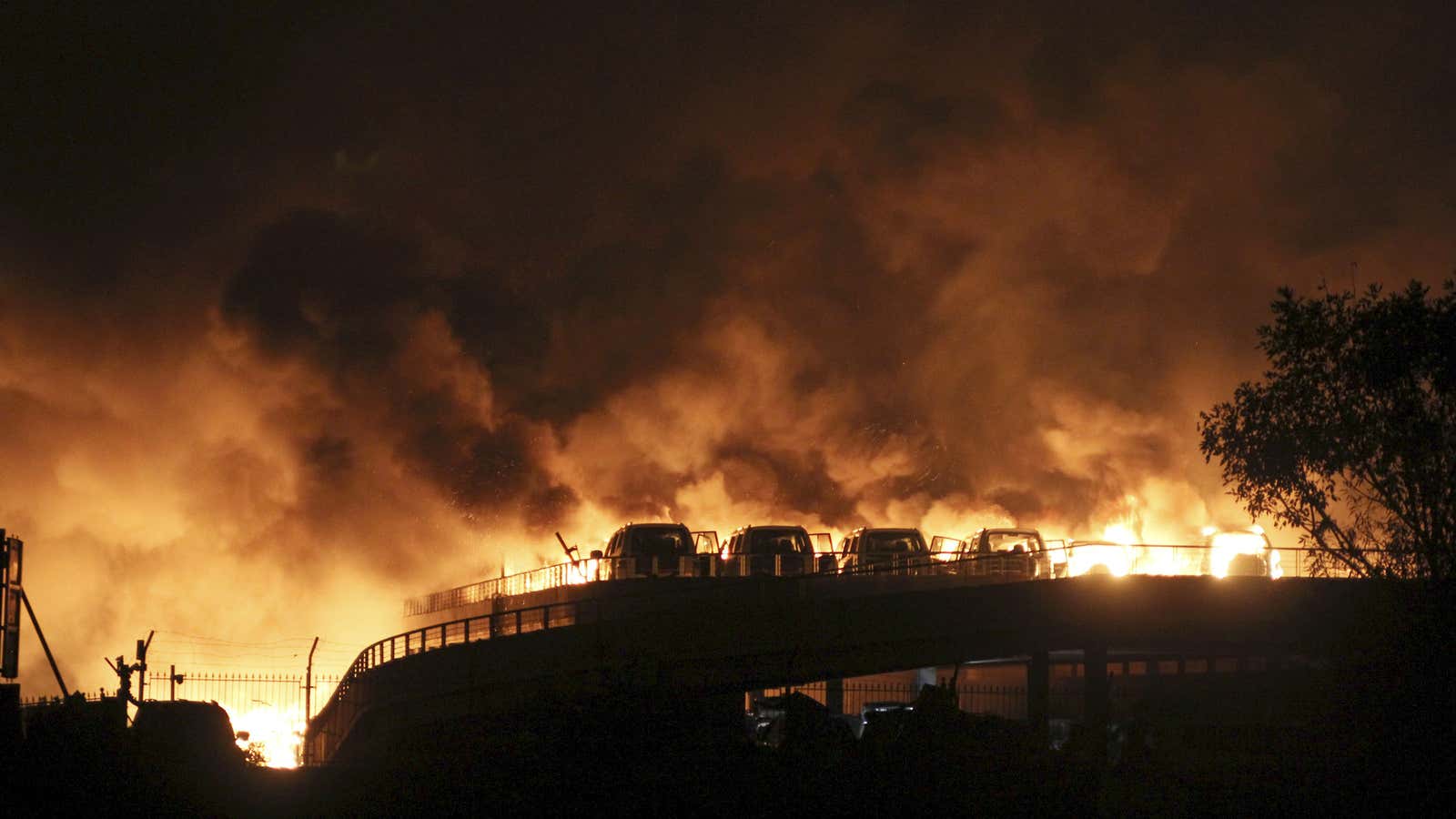 Vehicles burning after the blasts.