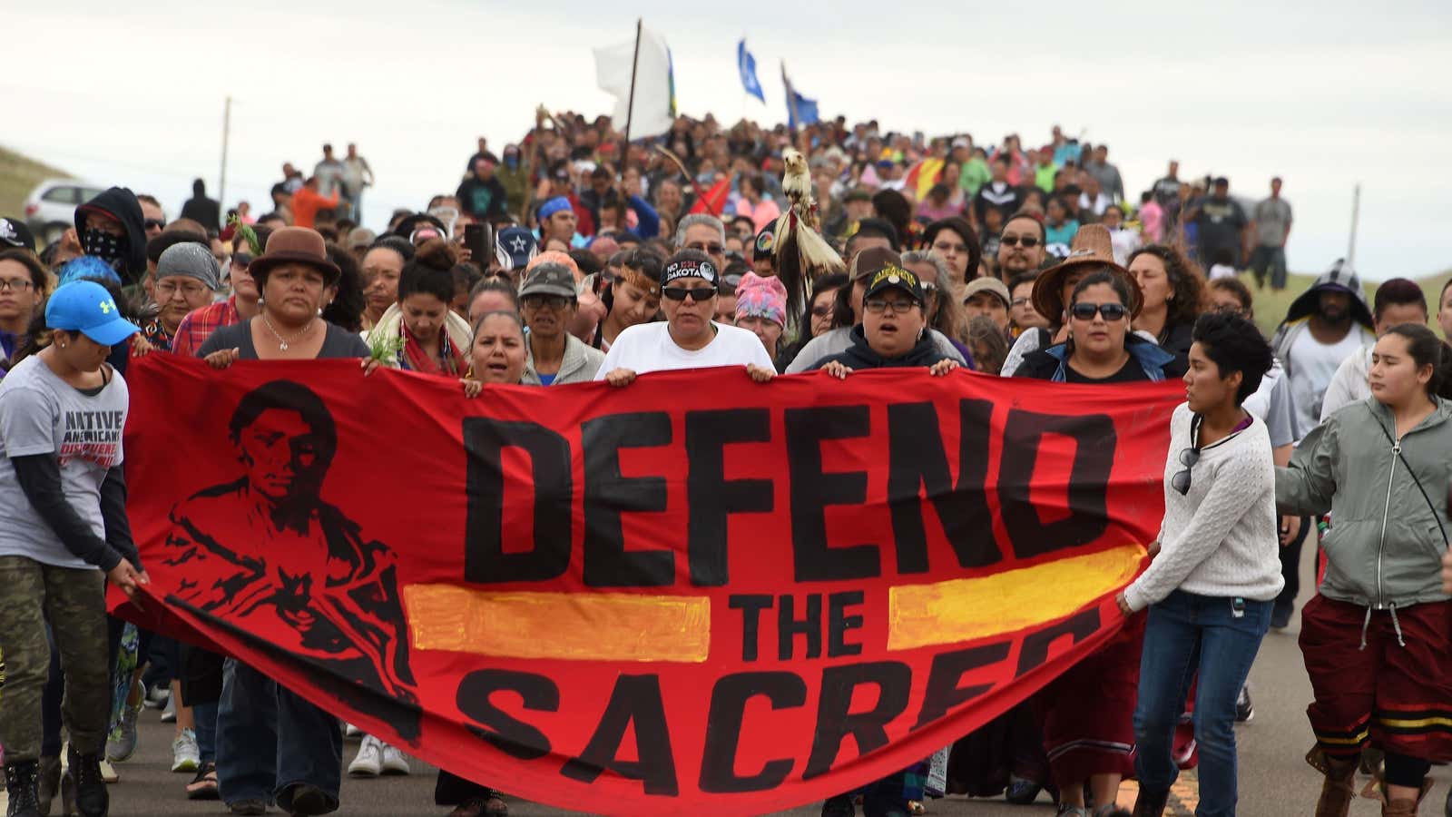 Native Americans march to the site of a sacred burial ground that was disturbed by bulldozers building the Dakota Access Pipeline on September 4, 2016, near Cannon Ball, North Dakota.