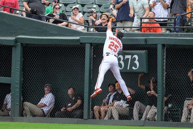 Jun 25, 2023; Baltimore, Maryland, USA; Baltimore Orioles right fielder Anthony Santander (25) makes a catch at the wall during the first inning against the Seattle Mariners at Oriole Park at Camden Yards.