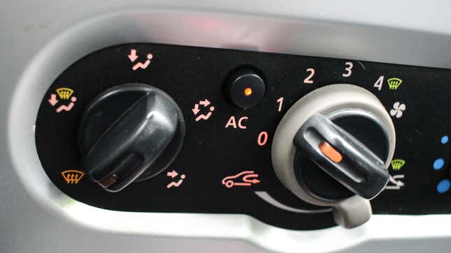 Air conditioning controls in the front of a car. 