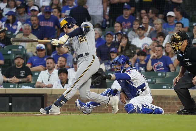 Aug 28, 2023; Chicago, Illinois, USA; Milwaukee Brewers designated hitter Mark Canha (21) hits a two-run home run against the Chicago Cubs during the first inning at Wrigley Field.