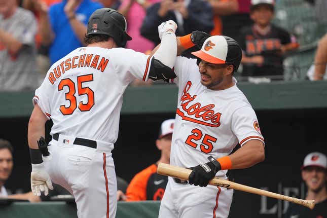 Aug 10, 2023; Baltimore, Maryland, USA; Baltimore Orioles designated hitter Adley Rutschman (35) is greeted by outfielder Anthony Santander (25) following his solo home run in the first inning against the Houston Astros at Oriole Park at Camden Yards.
