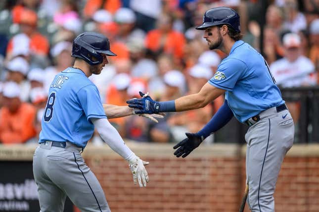 Sep 17, 2023; Baltimore, Maryland, USA; Tampa Bay Rays second baseman Brandon Lowe (8) and right fielder Josh Lowe (15) celebrate after a home run during the first inning against the Baltimore Orioles at Oriole Park at Camden Yards.