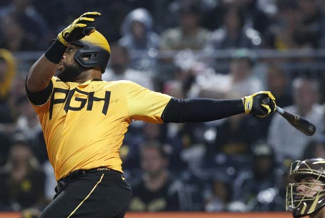 Jun 27, 2023; Pittsburgh, Pennsylvania, USA;  Pittsburgh Pirates first baseman Carlos Santana (41) hits a RBI single against the San Diego Padres during the sixth inning at PNC Park.