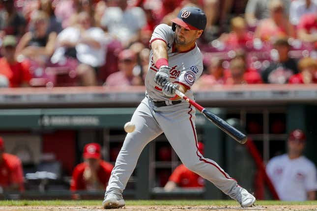 Aug 6, 2023; Cincinnati, Ohio, USA; Washington Nationals second baseman Jake Alu (39) hits a single against the Cincinnati Reds in the first inning at Great American Ball Park.
