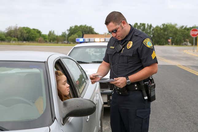 Police officer ticketing Black girl