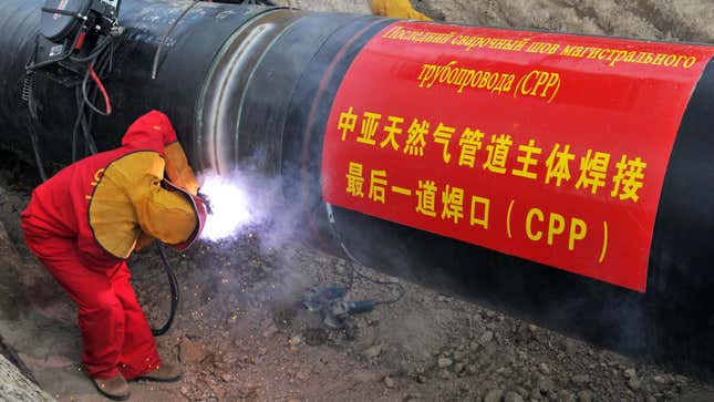 Workers complete welding the last pipe links at the construction site on the steppe near the country's commercial hub of Almaty July 10, 2009.