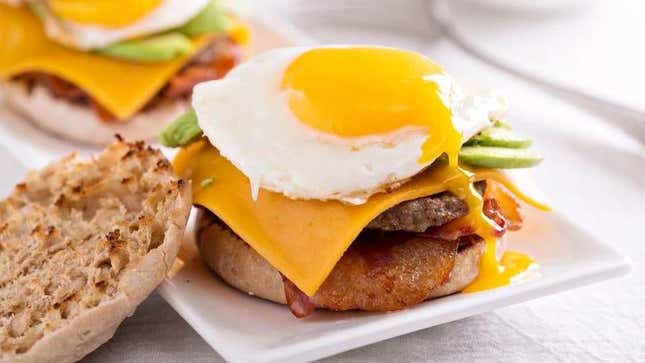 Breakfast burger with egg and beef on English muffin