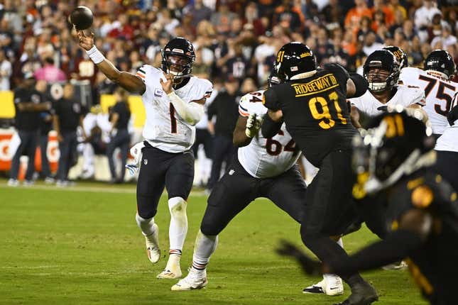 Chicago Bears' Justin Fields throws during the first half of an