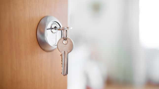Key in the lock of an open door