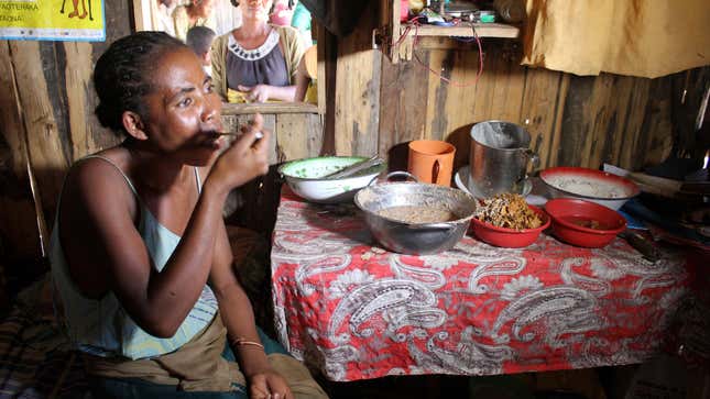 Bertine Sambetana eats clay mixed with tamarind at her home in the remote village of Fenoaivo, Madagascar.