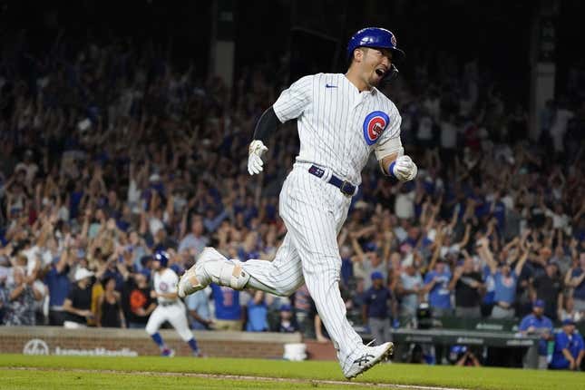 Sep 5, 2023; Chicago, Illinois, USA; Chicago Cubs right fielder Seiya Suzuki (27) hits a two-run home run against the San Francisco Giants during the seventh inning at Wrigley Field.