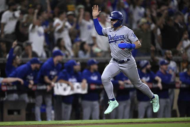 Aug 4, 2023; San Diego, California, USA; Los Angeles Dodgers left fielder Enrique Hernandez (8) scores a run against the San Diego Padres during the eighth inning at Petco Park.