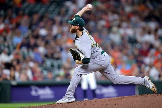 Sep 13, 2023; Houston, Texas, USA; Oakland Athletics starting pitcher Paul Blackburn (58) delivers a pitch against the Houston Astros during the first inning at Minute Maid Park.