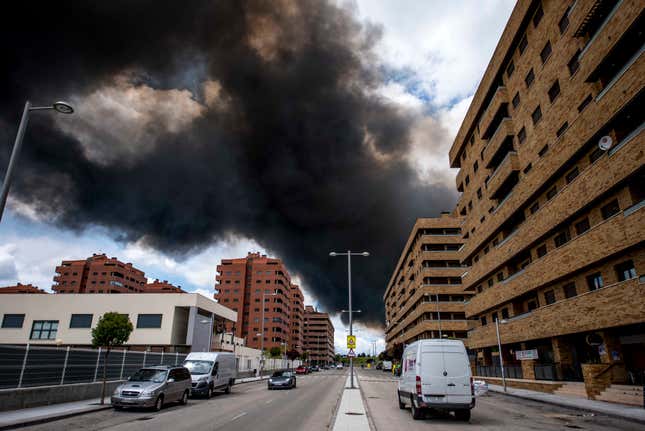 Black smoke rises in the sky over the housing area ‘El Quinon’ in Toledo, Spain.