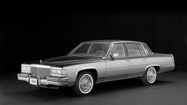 A black and whit photo of a 1980s Cadillac sedan. 