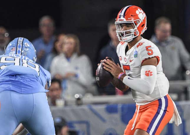 Clemson quarterback DJ Uiagalelei (5) fades back to pass near North Carolina defensive lineman Kevin Hester (98) during the first quarter of the ACC Championship football game at Bank of America Stadium in Charlotte, North Carolina Saturday, Dec 3, 2022.

Clemson Tigers Football Vs North Carolina Tar Heels Acc Championship Charlotte Nc