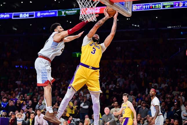 May 22, 2023; Los Angeles, California, USA; Los Angeles Lakers forward Anthony Davis (3) is fouled by Denver Nuggets guard Jamal Murray (27) during the fourth quarter in game four of the Western Conference Finals for the 2023 NBA playoffs at Crypto.com Arena.