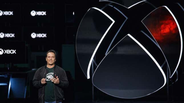Phil Sepncer stands on stage at an Xbox showcase. 