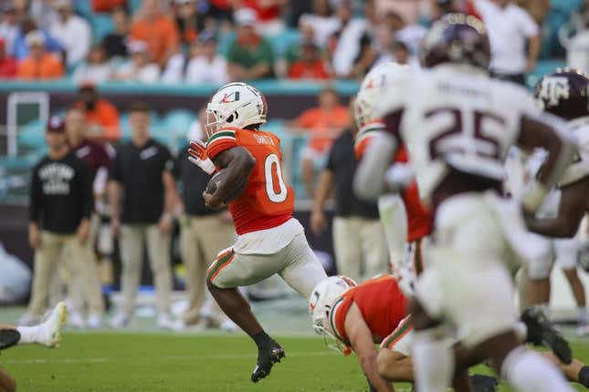 Sep 9, 2023; Miami Gardens, Florida, USA; Miami Hurricanes wide receiver Brashard Smith (0) returns the football for a touchdown against the Texas A&amp;amp;M Aggies during the third quarter at Hard Rock Stadium.