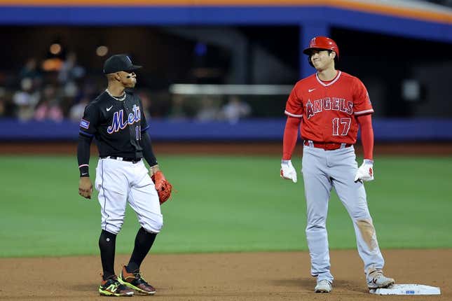 Aug 25, 2023; New York City, New York, USA; Los Angeles Angels designated hitter Shohei Ohtani (17) talks to New York Mets shortstop Francisco Lindor (12) at second base during the fifth inning at Citi Field.