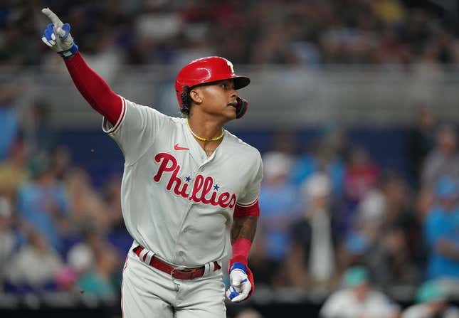 Jul 7, 2023; Miami, Florida, USA; Philadelphia Phillies left fielder Cristian Pache (19) watches his two-run home run clear the wall in the ninth inning against the Miami Marlins at loanDepot Park.