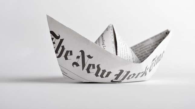 A page of the New York Times folded into a boat (or a hat, given your preference). 