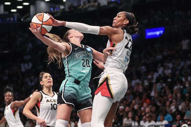 Aug 6, 2023; Brooklyn, New York, USA;  Las Vegas Aces forward A&#39;ja Wilson (22) blocks a shot taken by New York Liberty guard Sabrina Ionescu (20) in the first quarter at Barclays Center.
