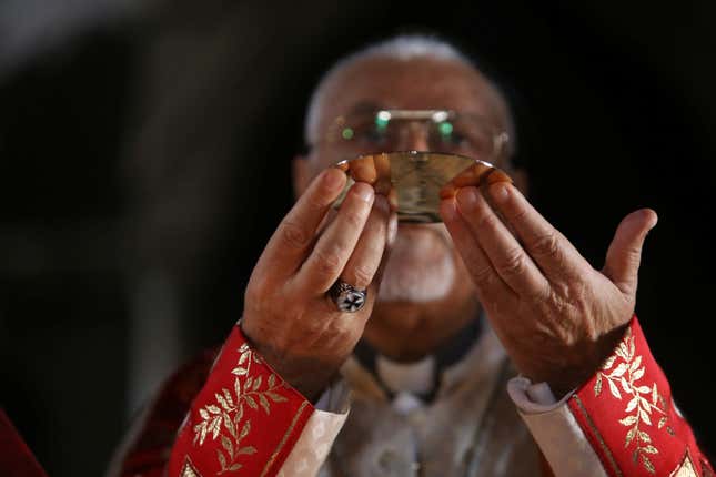 Iraqi priests hold the first mass at the Grand Immaculate Church since it was recaptured from Islamic State in Qaraqosh