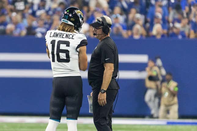 Sep 10, 2023; Indianapolis, Indiana, USA; Jacksonville Jaguars quarterback Trevor Lawrence (16) and head coach Doug Pederson talk during a timeout  in the second quarter against the Indianapolis Colts at Lucas Oil Stadium.