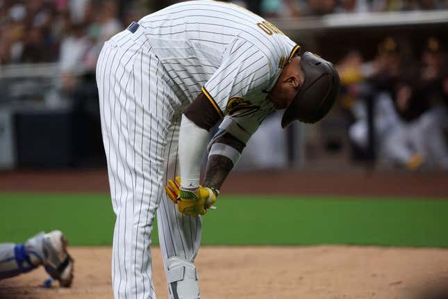 May 15, 2023; San Diego, California, USA;  San Diego Padres third baseman Manny Machado (13) reacts after being hit by a pitch during the second inning against the Kansas City Royals at Petco Park.