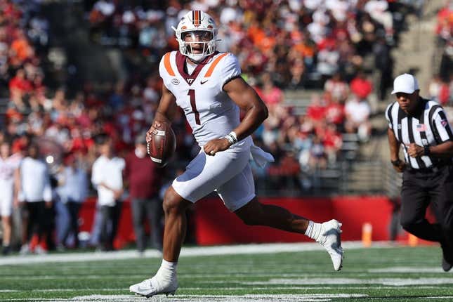 Sep 16, 2023; Piscataway, New Jersey, USA; Virginia Tech Hokies quarterback Kyron Drones (1) rolls out during the first half against the Rutgers Scarlet Knights at SHI Stadium.