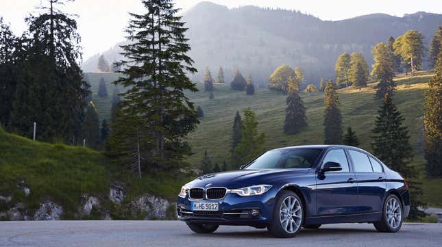 BMW sedan parked with a rolling hills backdrop