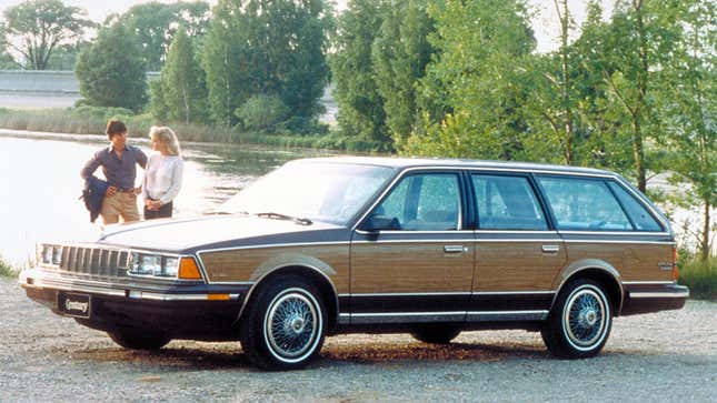 A photo of a brown and blue Buick Century station wagon. 