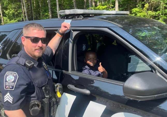Image for article titled Black Boy&#39;s Heartwarming Police Department Tour Goes Viral