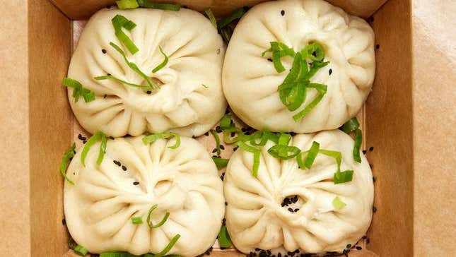 steamed dumplings in cardboard carryout box