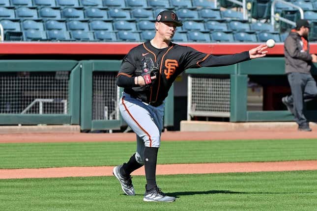Feb 16, 2023; Scottsdale, AZ, USA; San Francisco Giants pitcher Kyle Harrison (86) throws to first base during a drill during a Spring Training workout at Scottsdale Stadium.