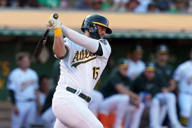 Aug 5, 2023; Oakland, California, USA; Oakland Athletics right fielder Seth Brown (15) hits an RBI single against the San Francisco Giants during the eighth inning at Oakland-Alameda County Coliseum.