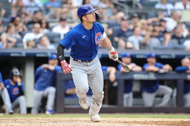 Jul 9, 2023; Bronx, New York, USA;  Chicago Cubs right fielder Seiya Suzuki (27) hits a go ahead RBI sacrifice fly in the eighth inning against the New York Yankees at Yankee Stadium.