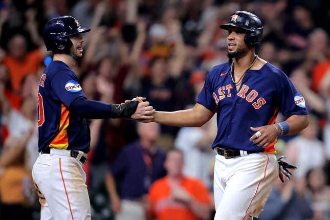 Jun 14, 2023; Houston, Texas, USA; Houston Astros first baseman Jose Abreu (79) is congratulated by Houston Astros right fielder Kyle Tucker (30) after crossing home plate for the winning run on a throwing error against the Washington Nationals during the ninth inning at Minute Maid Park.